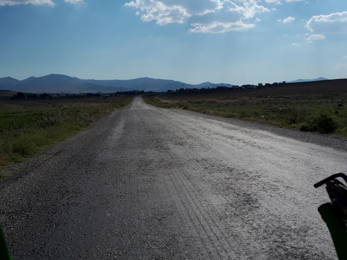 It seems that they had recently sprayed the roads with a fresh layer of asphalt, and in this summer sun it become a sticky adhesive liquid on the road surface. Our wheels sounded like they were tearing through velcro and got sticky enough to launch rocks everwhere.